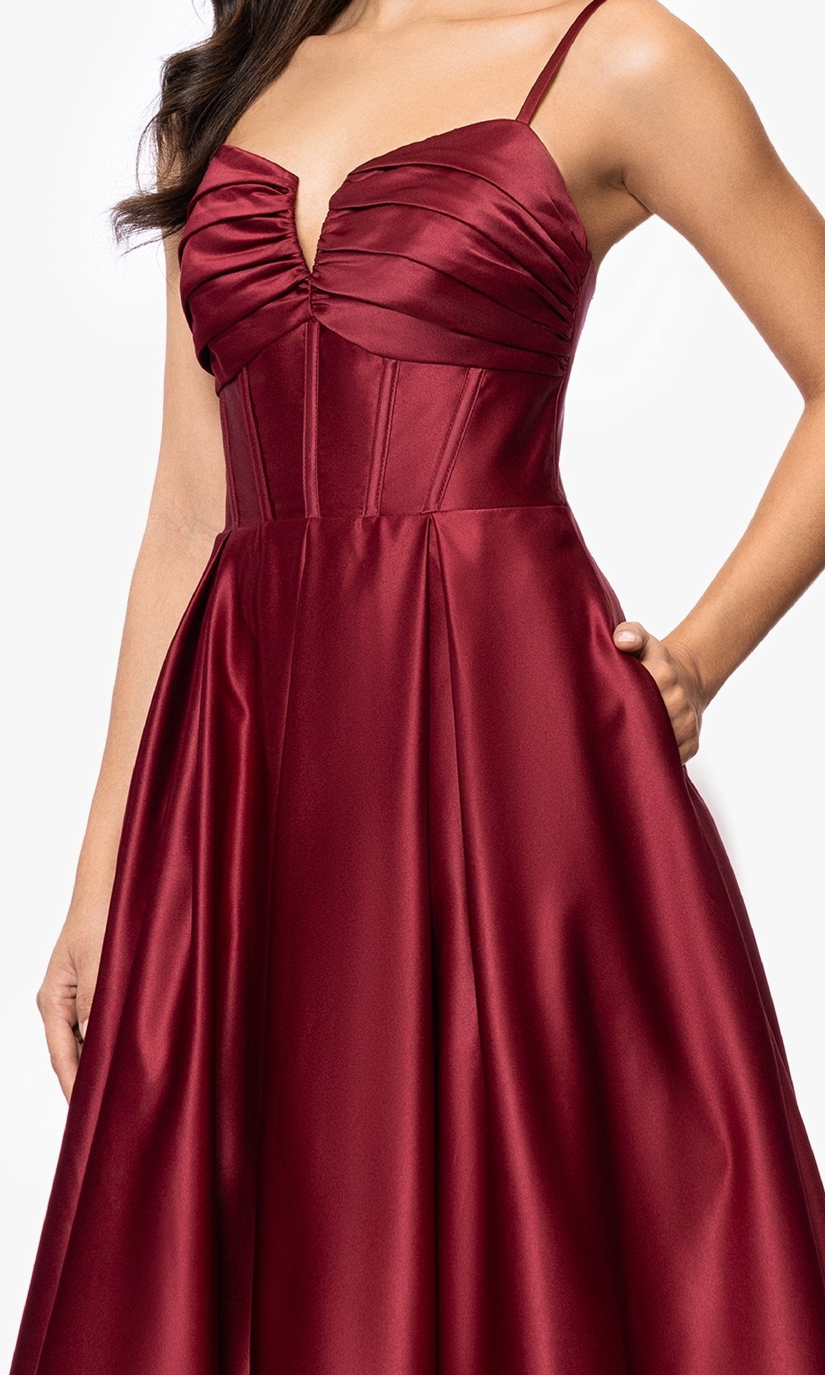 A woman in the Blondie Nites 5207BN long prom dress under $200, showcasing a ruched corset bodice, fitted waist, and flared satin skirt in deep red.